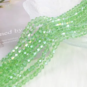 Close-up of 4mm AB peridot green crystal bicone glass beads for DIY jewelry making