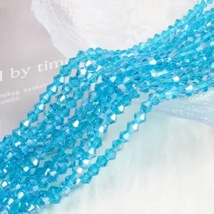 Macro detail of 4mm aqua blue AB crystal bicone glass beads for DIY jewelry making