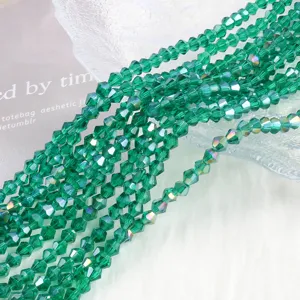 Close-up of 4mm green AB crystal bicone beads for DIY jewelry making.
