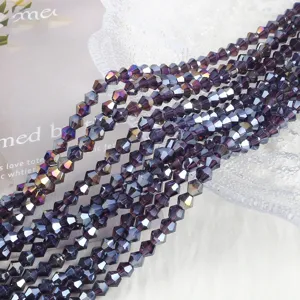 Macro view of 4mm faceted purple AB crystal bicone glass beads for DIY jewelry making