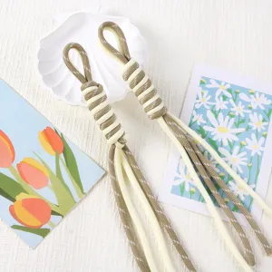 Detail of two-tone hand-woven Roman knot tassels for keychains, bags, or DIY crafts