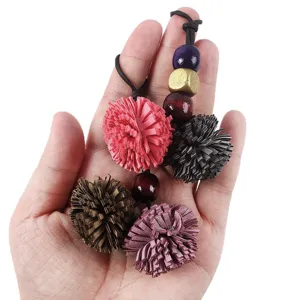 Handmade PU leather fringe pom pom charm with colorful wooden beads for bags and shoes decor.
