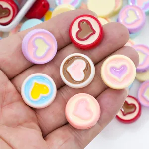Close-up detail of colorful acrylic heart beads, perfect for DIY jewelry making and bracelets.