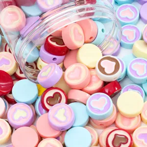 Acrylic heart bead detail shot, colorful handmade DIY jewelry accessory close-up view.