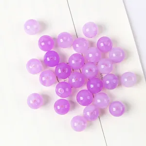 Macro view of purple cat eye acrylic round beads with threading holes for DIY jewelry making