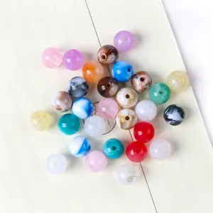 Close-up of colorful marbled acrylic beads for DIY jewelry making accessories