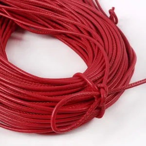 Macro detail view of 3mm red round PU leather cord showing fine stitching texture