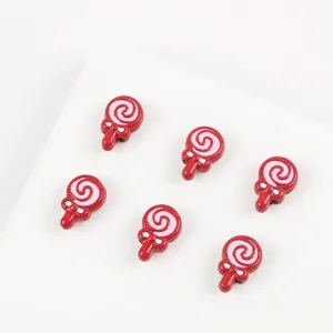 Red lollipop charm detail shot, alloy enamel DIY craft bead close-up for handmade bracelets.