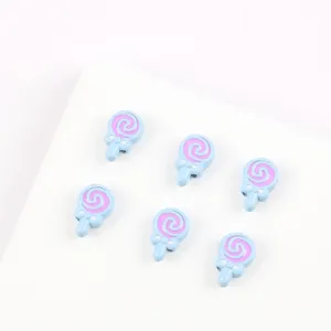 Close-up detail of cute lollipop shaped alloy enamel beads, perfect for DIY jewelry making.