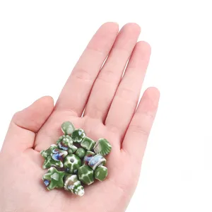 Assorted green kiln-glazed ceramic beads in mixed shapes for DIY jewelry making