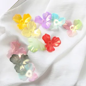 Close-up of colorful AB iridescent acrylic magnolia petal beads for DIY jewelry