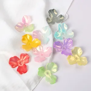 Close-up of iridescent acrylic magnolia flower petal beads for DIY hair accessories