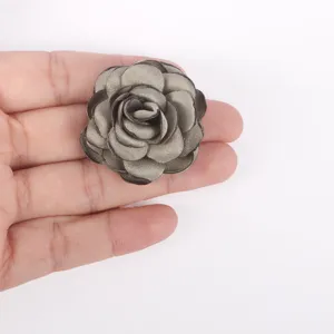 Detailed view of handmade burnt edge fabric rose flower for DIY crafts