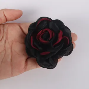 Detailed view of a 7.5cm black and burgundy chiffon burnt edge rose for DIY craft projects