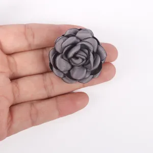 Close-up view of a handmade grey burnt-edge 3D fabric rose flower DIY accessory