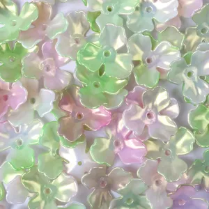 Macro detail of iridescent AB finish acrylic flower petal beads for DIY jewelry making