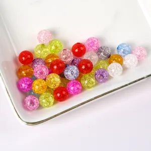 Detailed view of colorful crackle glass beads, ice cracked loose beads for DIY jewelry making.