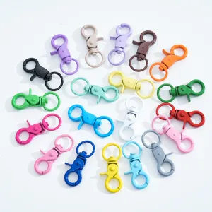Colorful metal lobster swivel clasps detail shot, ideal for DIY keychains and jewelry making.