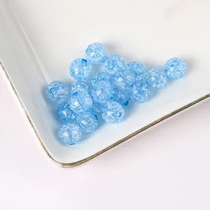 Detailed close-up of blue crackle glass beads showing unique inner texture for DIY jewelry making.