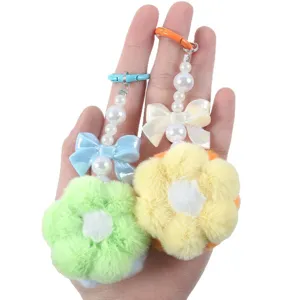 Adorable handmade plush flower keychain with faux pearl beads and bow detail charm