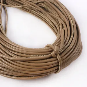 Close-up macro detail of 3mm round PU leather cord with decorative stitching for DIY bags