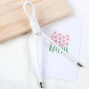 Detail view of 5mm white pearlescent PU leather cord, core rope for DIY handmade bag charms.