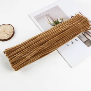 Close-up of brown plush pipe cleaners for DIY bouquet crafts, fuzzy stems accessory.