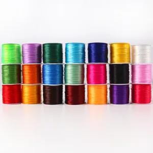 Macro detail of various colorful elastic crystal thread spools for beading and DIY jewelry