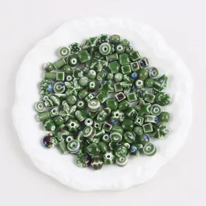 Assorted green kiln change ceramic beads in mixed shapes for DIY jewelry making