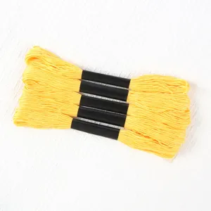 Five bundles of bright yellow six-strand polyester embroidery floss for cross stitch