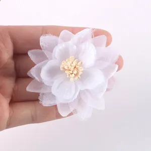 Close-up of a white handmade chiffon organza flower with multi-layer petals