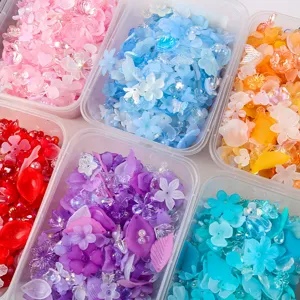 Macro view of colorful frosted AB acrylic petal and leaf beads in clear containers