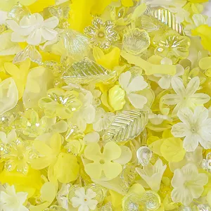 Close-up of yellow frosted and iridescent AB acrylic flower petal and leaf beads