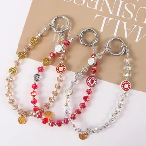 Sparkling crystal beaded phone lanyard short wrist chain wealth charm strap accessory for women.