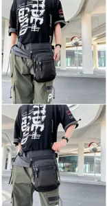 Black tactical drop leg bag with multi-pockets for motorcycle riding and outdoor hiking