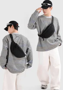 Lightweight black sport chest bag shown on male model from front and back views