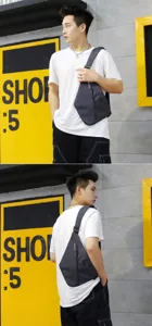Slim grey anti-theft crossbody chest bag for men shown on a model in urban setting