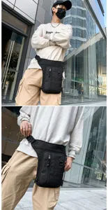 Close-up detail of the black multifunctional tactical leg bag for outdoor cycling activities
