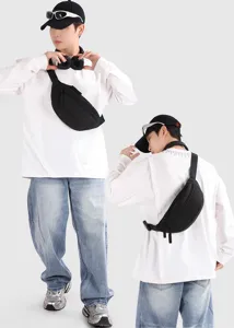 Professional front and back showcase of a black outdoor sports chest bag on a male model.
