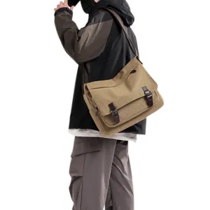 Large capacity men's canvas messenger bag worn by a model for fashion street style.