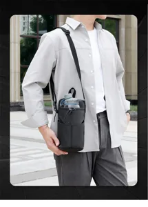 Black crossbody water bottle carrier bag for men shown on model in urban lifestyle setting