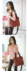 Stylish Asian model showing a large red canvas shoulder bag in a bright casual indoor setting