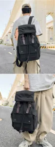 Detailed view of a black canvas drawstring backpack for urban travel and street fashion.