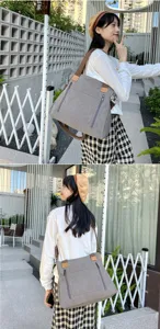 Stylish large grey canvas crossbody bag for women shown in an outdoor lifestyle setting.