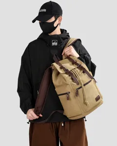 Detailed view of a khaki canvas backpack with large capacity for travel and daily use
