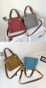 Detail view of retro canvas tote bags in multiple colors with front zipper pockets