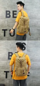 Detailed side and rear views of a khaki canvas backpack worn by a male model outdoors.