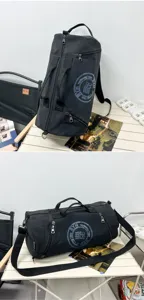 A detailed view showing the black canvas barrel duffel bag from two different angles