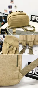 Detailed macro view of khaki canvas backpack showing durable straps and fabric texture