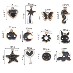 Assortiment zwart witte geëmailleerde legering bedels hangertjes voor DIY sieraden maken knutselen.